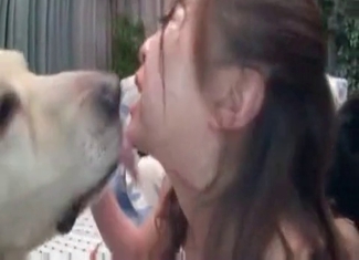 Asian babe is making her puppy kiss her