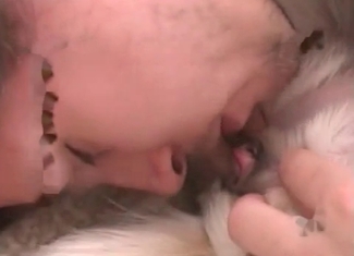 Wild fellow is giving a blowjob to a puppy